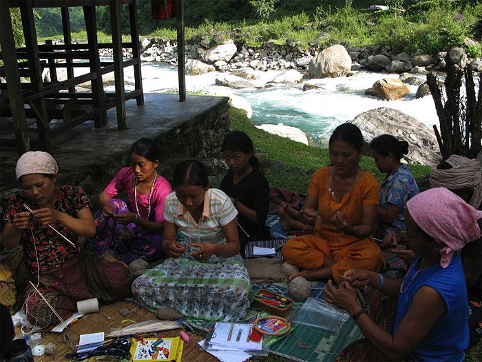 Photograph of some women casting on